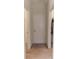 Hallway view with neutral carpet and white painted doors at 4928 Cortland Dr, Davenport, FL 33837