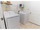 Practical laundry room with modern appliances and wire shelving at 4928 Cortland Dr, Davenport, FL 33837