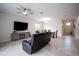 Open concept living space with dining area and views of the front entrance with tile floors at 4928 Cortland Dr, Davenport, FL 33837