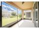 Screened patio offering outdoor living with a lush lawn and backyard view at 4928 Cortland Dr, Davenport, FL 33837