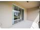 Covered patio with sliding glass doors offering backyard views at 4928 Cortland Dr, Davenport, FL 33837
