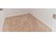 Bright walk-in closet featuring neutral carpeting and white baseboards at 4928 Cortland Dr, Davenport, FL 33837