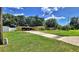 Charming single-story home with a covered parking, lush lawn, and mature trees offering shade at 518 Oranole Rd, Maitland, FL 32751