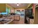 Well-lit kitchen showing ample counter space, stainless steel appliances and connection to living area at 518 Oranole Rd, Maitland, FL 32751