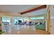 Open living room with lots of natural light and a beamed ceiling at 518 Oranole Rd, Maitland, FL 32751