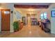 Inviting space with a unique wood door, decorative accents, and an open view into the modern kitchen at 518 Oranole Rd, Maitland, FL 32751