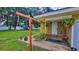 Side porch with a swing, decorative plants, and serene outdoor space at 518 Oranole Rd, Maitland, FL 32751