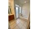 Bathroom offers a vanity area, tile floors, and shower and bathtub combo at 5230 Clarion Oaks Dr, Orlando, FL 32808