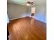 Spacious bedroom boasts wood-look floors and a ceiling fan at 5230 Clarion Oaks Dr, Orlando, FL 32808