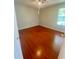 Bedroom features wood-look flooring and a window at 5230 Clarion Oaks Dr, Orlando, FL 32808