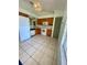A spacious kitchen with a window and white appliances offer ample cooking and storage space at 5230 Clarion Oaks Dr, Orlando, FL 32808