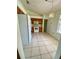 Kitchen with white appliances, tiled floors, and wooden cabinetry offer ample cooking and storage space at 5230 Clarion Oaks Dr, Orlando, FL 32808