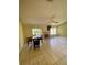 Spacious living room features tile floors, a ceiling fan and a fireplace at 5230 Clarion Oaks Dr, Orlando, FL 32808