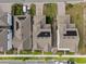 Birds eye view of homes in a neighborhood with solar panels visible on the roofs at 6522 Rover Way, St Cloud, FL 34771