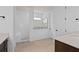 Modern bathroom featuring tile floors, a walk-in shower, white subway tile, and stylish fixtures at 6522 Rover Way, St Cloud, FL 34771