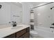 Clean bathroom with a tub and shower combination and sleek, dark fixtures at 6522 Rover Way, St Cloud, FL 34771