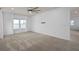 Spacious bedroom with a ceiling fan, a wall mount for a TV, and plenty of natural light at 6522 Rover Way, St Cloud, FL 34771