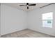 Bright bedroom featuring a ceiling fan, window, and carpeted floors, creating a cozy atmosphere at 6522 Rover Way, St Cloud, FL 34771