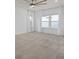 Bright bedroom with large windows adorned with curtains allowing natural light and ample space at 6522 Rover Way, St Cloud, FL 34771
