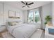 Serene bedroom with neutral tones, a large window, and stylish furnishings creating a relaxing atmosphere at 6522 Rover Way, St Cloud, FL 34771