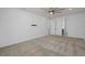 A bright and spacious bedroom includes a ceiling fan and a wall mount for a TV at 6522 Rover Way, St Cloud, FL 34771