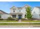 Inviting two-story home with a charming front porch and well-maintained landscaping at 6522 Rover Way, St Cloud, FL 34771