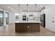 Modern kitchen features a large center island, stainless steel appliances, and stylish pendant lighting at 6522 Rover Way, St Cloud, FL 34771