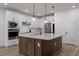 Well-equipped kitchen boasting a spacious island, built-in microwave and oven, and sleek stainless steel appliances at 6522 Rover Way, St Cloud, FL 34771