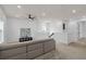 Upstairs loft featuring neutral paint, plush carpet, and a comfortable sectional sofa, perfect for relaxing at 6522 Rover Way, St Cloud, FL 34771