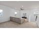 Cozy loft space with a comfortable sectional sofa, neutral carpeting, and ample natural light at 6522 Rover Way, St Cloud, FL 34771