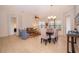 Bright living room featuring tile floors, contemporary furnishings, and natural light from large windows at 730 Villa Park Rd, Poinciana, FL 34759