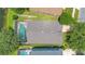 Overhead view of a private backyard with screened-in pool, well-maintained landscaping, and neighborhood setting at 746 Stonewyk Way, Kissimmee, FL 34744