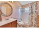 Bathroom with tub and shower combo, vanity and large circular mirror at 746 Stonewyk Way, Kissimmee, FL 34744