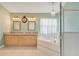 Bright bathroom features a double sink vanity, large tub, and glass-enclosed shower at 746 Stonewyk Way, Kissimmee, FL 34744