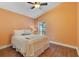Cozy bedroom with wood floors and a large window at 746 Stonewyk Way, Kissimmee, FL 34744