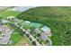 Aerial view of neighborhood amenities, featuring tennis courts, playground, pool, and greenspace at 746 Stonewyk Way, Kissimmee, FL 34744