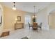 Bright dining room with elegant chandelier, perfect for Gathering meals and entertaining guests at 746 Stonewyk Way, Kissimmee, FL 34744