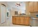 Spacious kitchen area featuring light wood cabinetry and stainless steel appliances at 746 Stonewyk Way, Kissimmee, FL 34744