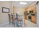 Kitchen view showcases stainless steel appliances, granite countertops, and wooden cabinets at 746 Stonewyk Way, Kissimmee, FL 34744