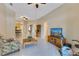 Open-concept living room with tile floors, neutral walls, and seamless flow to other living areas at 746 Stonewyk Way, Kissimmee, FL 34744