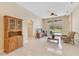 Bright and airy living room showcasing neutral tile flooring and backyard pool views at 746 Stonewyk Way, Kissimmee, FL 34744