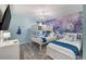 Delightful bedroom with a bunk bed and queen bed, adorned with Frozen-themed wallpaper and a decorative chandelier at 9126 Sommerset Hills Dr, Davenport, FL 33896