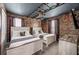 Charming bedroom featuring two beds, themed wallpaper and an overhead light, perfect for a cozy and imaginative space at 9126 Sommerset Hills Dr, Davenport, FL 33896