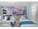 Adorable bedroom with a bunk bed and queen bed, themed with Frozen wallpaper and decor, creating a magical atmosphere at 9126 Sommerset Hills Dr, Davenport, FL 33896
