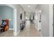 Spacious hallway with an arcade game and access to multiple rooms at 9126 Sommerset Hills Dr, Davenport, FL 33896