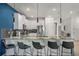 Kitchen bar with modern chairs and lighting fixtures at 9126 Sommerset Hills Dr, Davenport, FL 33896