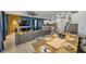 Open-concept living and dining area features a ceiling fan, modern lighting, and a breakfast bar at 9126 Sommerset Hills Dr, Davenport, FL 33896