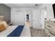 Cozy primary bedroom with a view into an additional room, featuring modern decor and ample natural light at 9126 Sommerset Hills Dr, Davenport, FL 33896