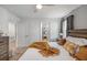 Inviting primary bedroom with warm tones, comfortable bedding, and a view into an additional room for added spaciousness at 9126 Sommerset Hills Dr, Davenport, FL 33896