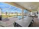 Enclosed pool with a seating area, outdoor dining, and lounge chairs at 9126 Sommerset Hills Dr, Davenport, FL 33896